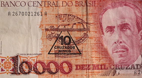 Old Brazilian money note, with Central Bank stamp changing the denomination and value, from Cruzados to Cruzados Novas, due to economic plans to contain inflation in the 1990s