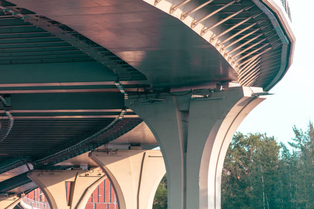 istock Concrete pillars of a large bridge. Bottom view 2151271030