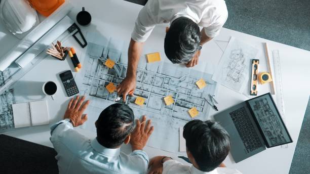 istock Top view of designer writing at sticky note while planning design. Alimentation. 2151273056