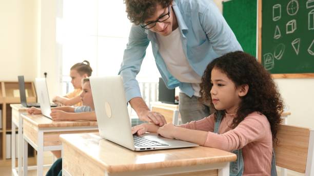 istock American girl learning about prompt while student sitting at class. Pedagogy. 2151273104