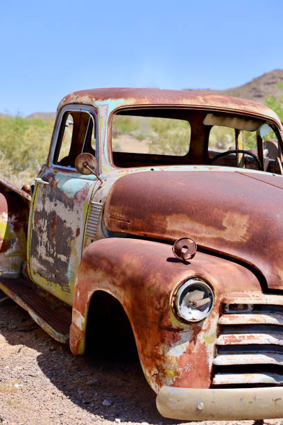 istock Vintage pickup truck rusting in the desert 2151273248