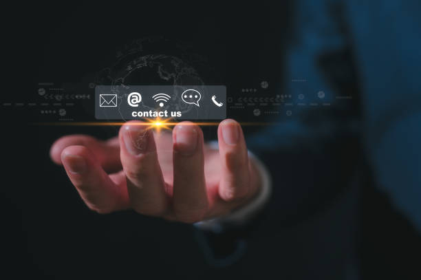 istock Contact us or Customer support hotline people connect. Businessman holding virtual screen contact icons  email, address, live chat, internet wifi 2151273791