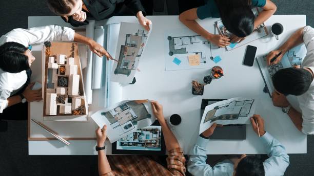 istock Aerial view business people brainstorming about building interior. Alimentation. 2151274267