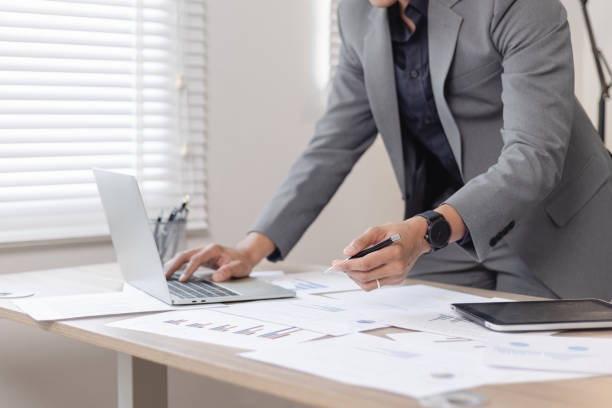 istock Businessman working on laptop with analysis and financial planning. 2151276488