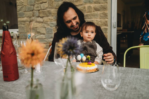 istock A little boy is celebrating his first birthday with his dad 2151278542