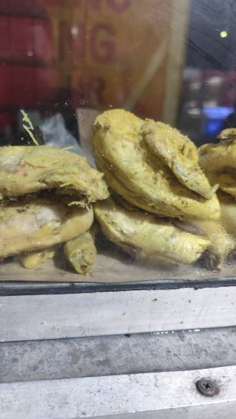 Portrait of yellow spiced chicken ready to be fried