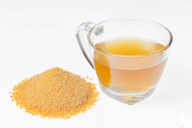 Drink of piloncillo and ground piloncillo, on white background, traditional drink of Colombia