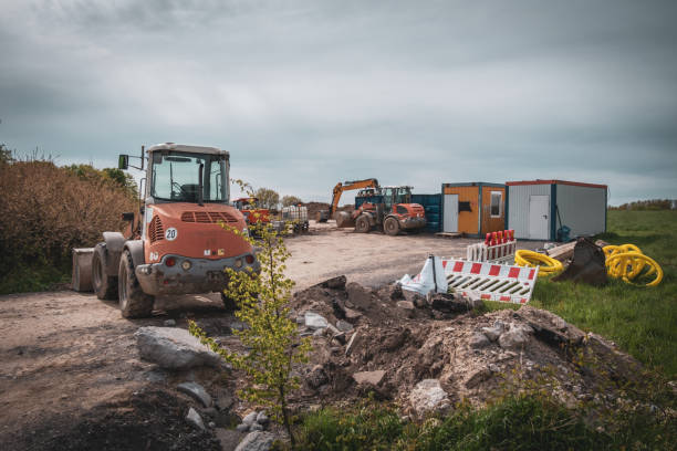 istock there is a large excavator and containers on a large building site 2151282755