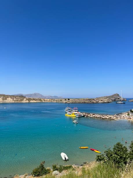 istock Colorful Boats Bobbing in Lindos Beach 2151284134