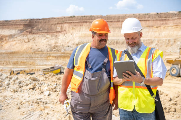 istock A manager and a worker work together in a kaolin quarry. 2151285301