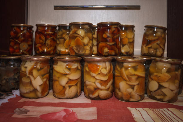 Marinated mushrooms in a glass jar.