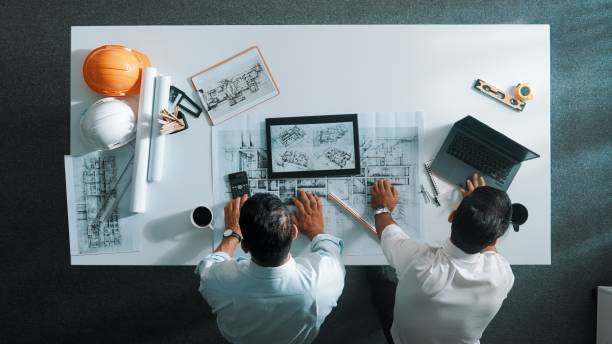 istock Top view of engineer working together to plan building design. Alimentation. 2151286503
