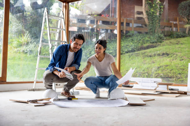 istock Couple sharing some decoration ideas while renovating their house 2151288704