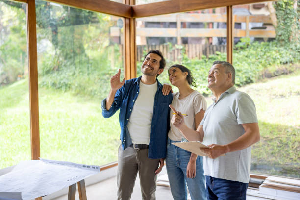 istock Architect renovating a house and discussing ideas with the owners 2151288718