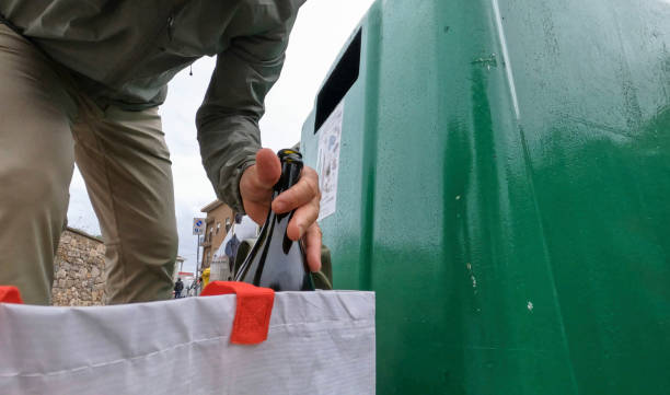 istock POV of hands recycling bottles 2151288916