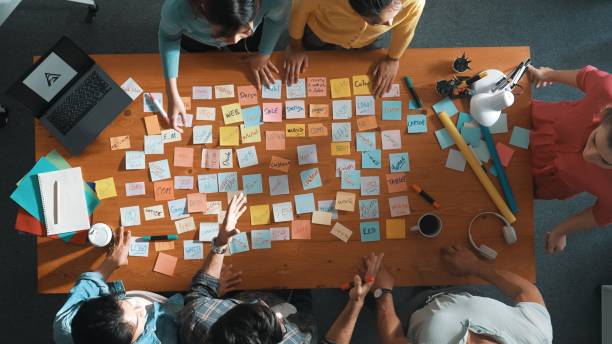 istock Top view of manager looking idea on sticky notes and explain idea. Symposium. 2151289237