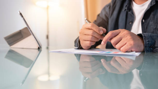 istock men hand working on paperwork on meeting room 2151291592