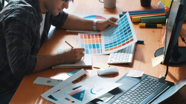 istock Designer look at screen and design color while looking at palette. Symposium. 2151292639