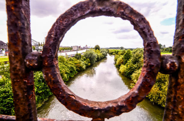 istock A rusty metal fence with a circular hole in the middle 2151293889