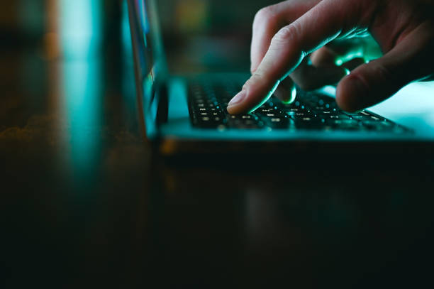 istock Man working on laptop at night. Overtime working at night. 2151295150