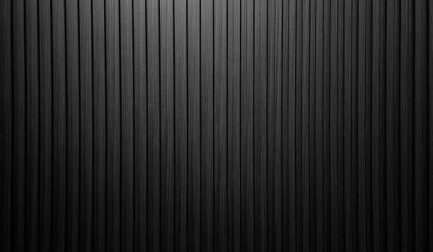 istock vertical dark black wooden slats texture for interior decoration with light from above. 2151295213