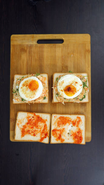 istock A Golden-Yolk Fried Egg Sandwich on Toast for a Delightfully Savory Breakfast. Designed to Elevate Your Morning Rituals with Delightfully Savory Flavor and Nourishing Satisfaction 2151297388
