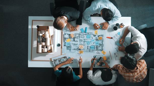 istock Top view of project manager or engineer writing at blueprint. Alimentation. 2151298867