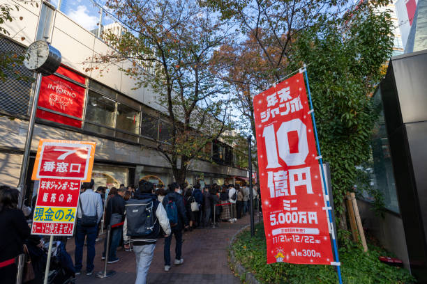 Tokyo, Japan - November 23, 2023 : People queue to purchase the Year-End Jumbo Lottery tickets in Tokyo, Japan.