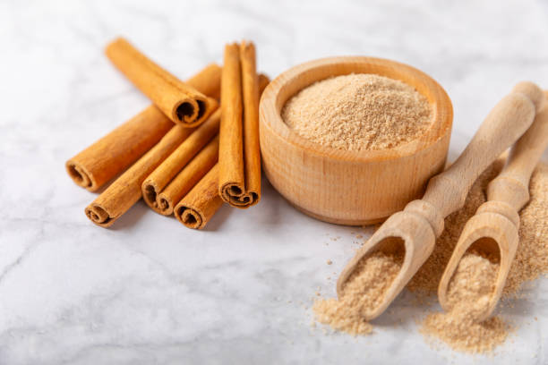 istock Cinnamon sugar on  background. Homemade cinnamon sugar in a bowl on background. Brown sugar. Spice mixture for drinks and baking. Place for text. Copy space. 2151301121