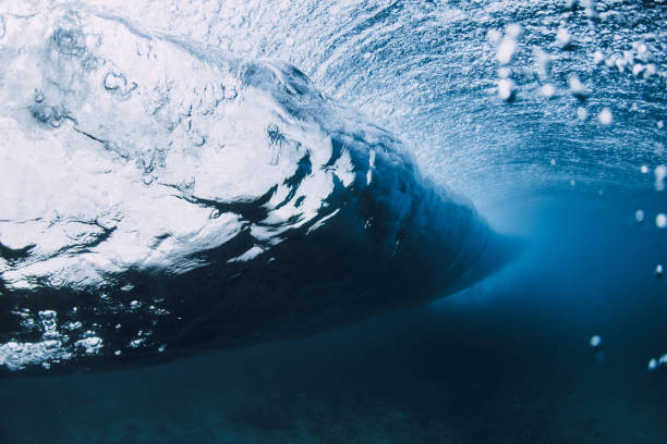 istock Wave underwater. Blue ocean in underwater. Surfing barrel wave 2151306469