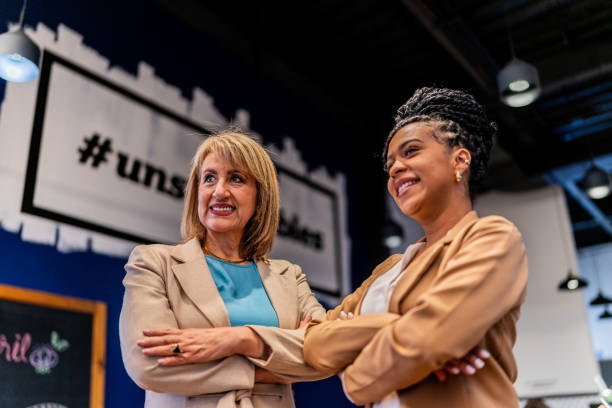 istock Businesswomen looking away at office 2151309482