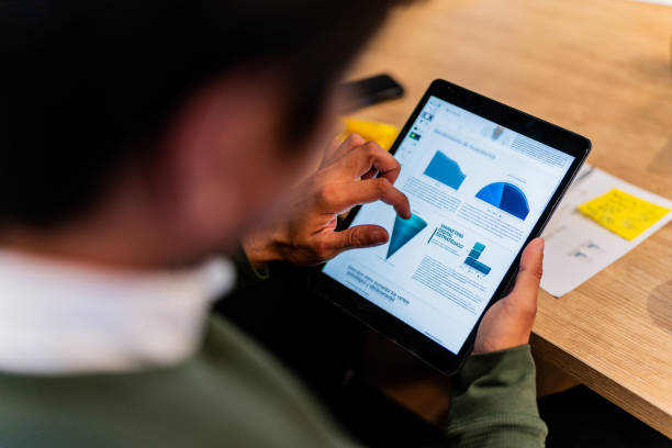 istock Close-up of a businessman using digital tablet at office 2151309518