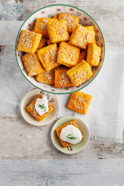 istock Salty cracker and cookies in bowl. Biscuit. Cookie. Cracker. Biscuit with cream cheese. Salticrax with a cottage cheese. Cream Cheese on Crackers 2151310289