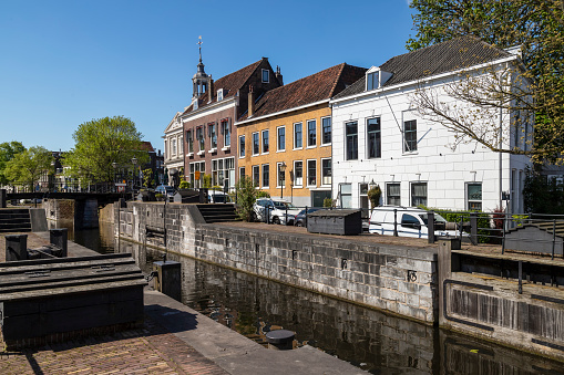 Lock and monumental buildings in the historic center of Schiedam in the Netherlands.