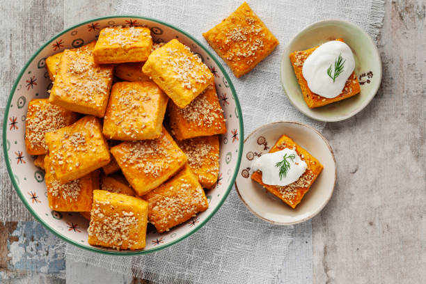 Salty cracker and cookies in bowl. Biscuit. Cookie. Cracker. Biscuit with cream cheese. Salticrax with a cottage cheese. Cream Cheese on Crackers