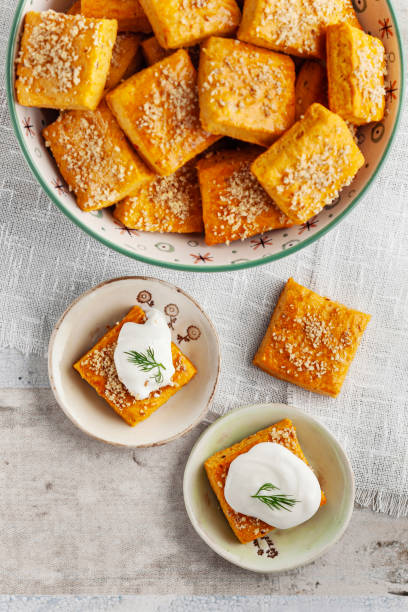 istock Salty cracker and cookies in bowl. Biscuit. Cookie. Cracker. Biscuit with cream cheese. Salticrax with a cottage cheese. Cream Cheese on Crackers 2151311764