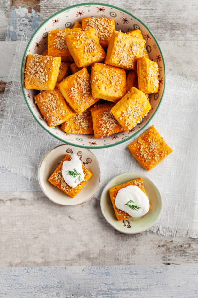 istock Salty cracker and cookies in bowl. Biscuit. Cookie. Cracker. Biscuit with cream cheese. Salticrax with a cottage cheese. Cream Cheese on Crackers 2151312120