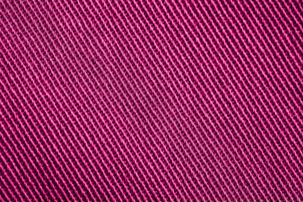 Closeup of pink textured cloth background for design purpose