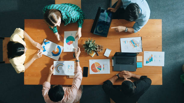 istock Top view of manager use tablet to analyze data and financial chart. Convocation. 2151314167