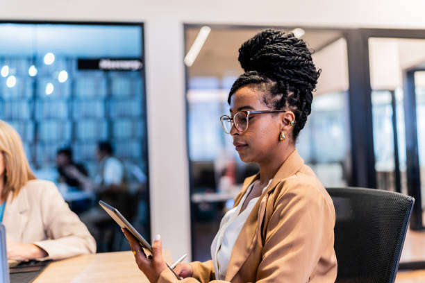 istock Businesswoman using digital tablet at office 2151315365