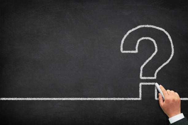 istock Question mark design with a male hand writing on chalkboard 2151315835