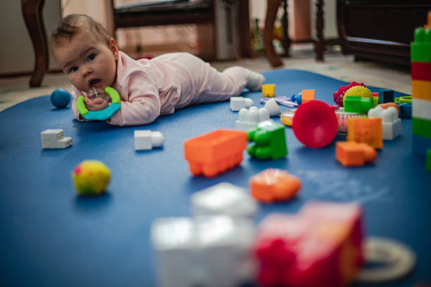 Small children play with toys alone
