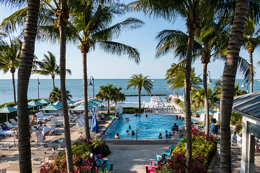 People Lounging by a Resort Pool at Oceanfront in Marathon Florida