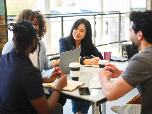 istock Team Business Meeting in a Small Cafe 2151328179