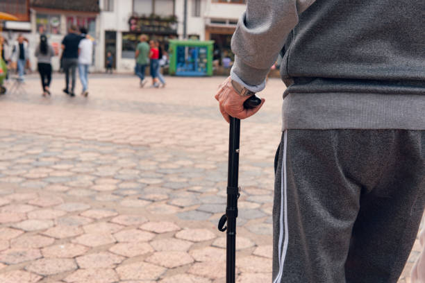 istock older man walking with cane and comfortable clothes 2151328527