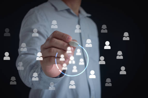 istock Marketing target audience concept. Marketing segmentation, customer care, customer relationship management (CRM) and team building concepts. Businessman writing circle to mark to focus customer group. 2151329758