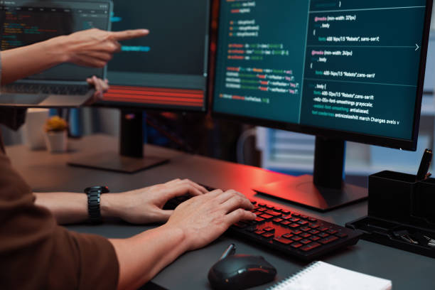 istock IT developers discussing intelligent website with laptop showing data. Infobahn. 2151330928