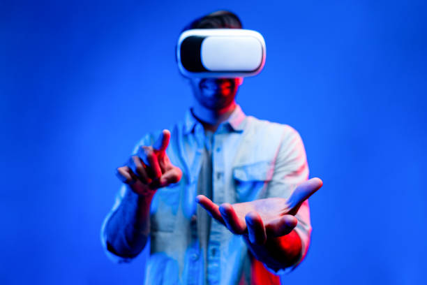 istock Caucasian man with VR glasses while holding hologram display in VR. Deviation. 2151331336