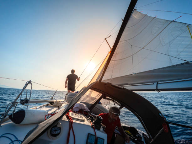 Sailor watching the environment on a sailboat.