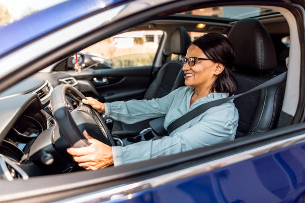 istock Senior woman driving a car 2151332552